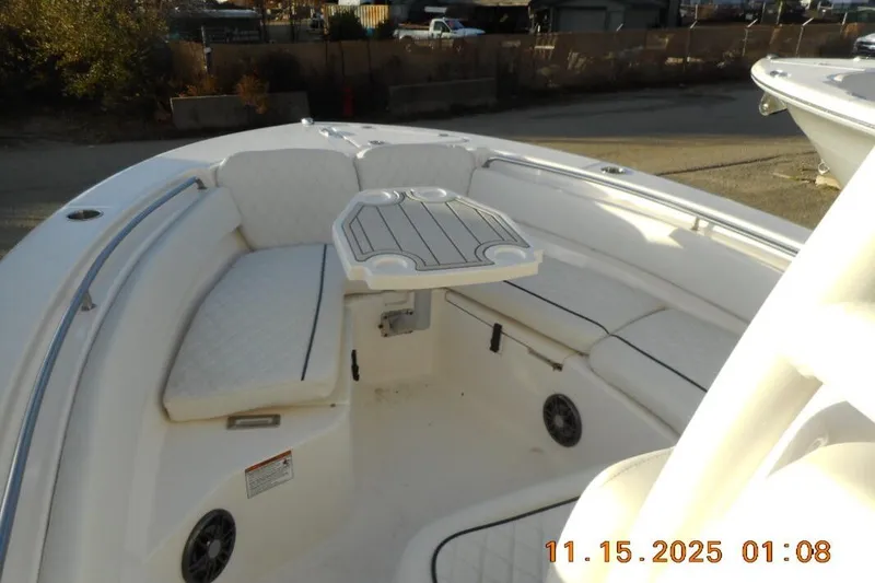 Slide: The Image of 2026 Sea Fox 248 Side Console boat interior with cushioned seating and table. - 15