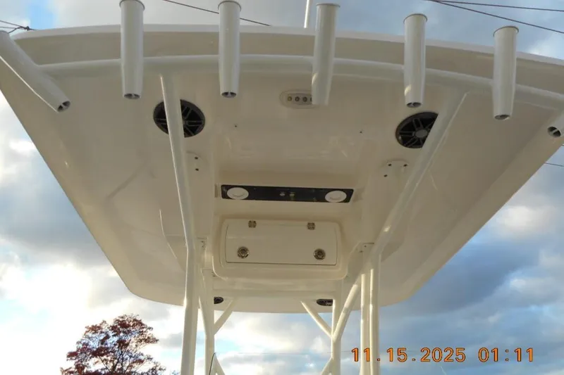 Slide: The Image of Underneath view of a 2026 Sea Fox 248 Side Console boat's canopy with rod holders. - 17