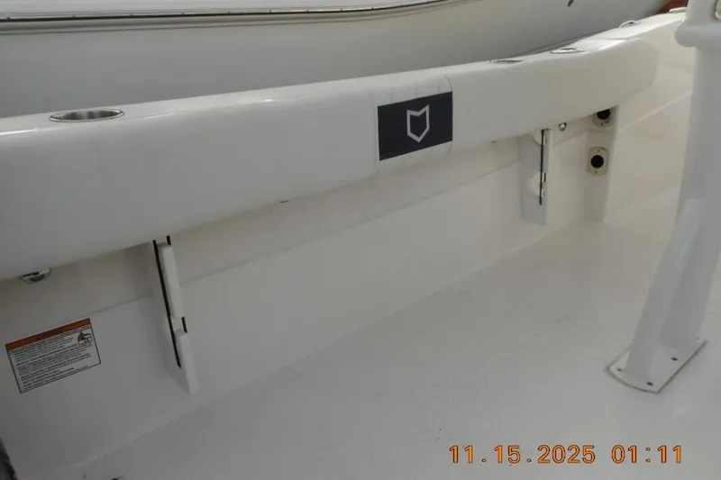 Slide: The Image of 2026 Sea Fox 248 Side Console boat interior with cup holders and clean white deck. - 18