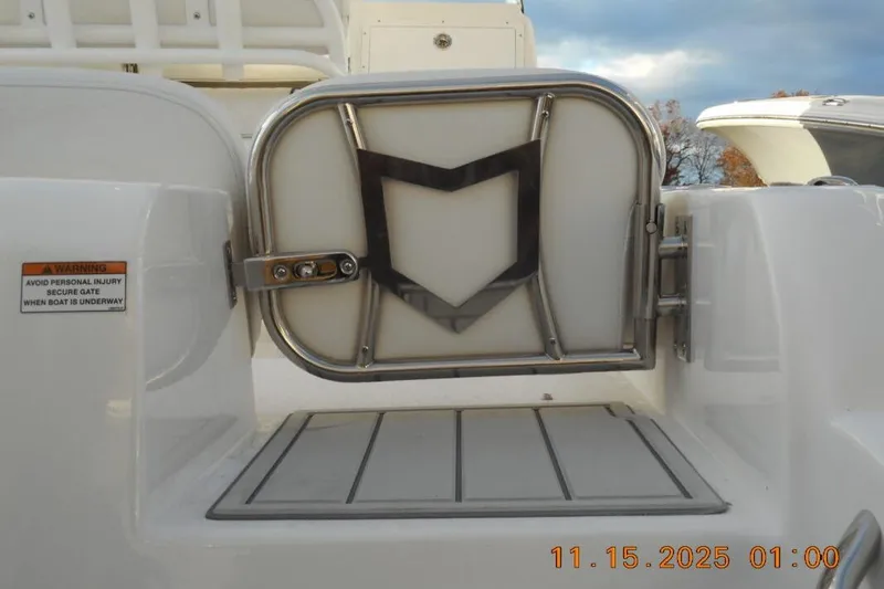 Slide: The Image of 2026 Sea Fox 248 Side Console boat gate with safety warning label. - 3