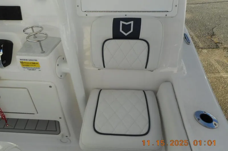 Slide: The Image of 2026 Sea Fox 248 Side Console boat seating with cup holders and capacity label. - 7