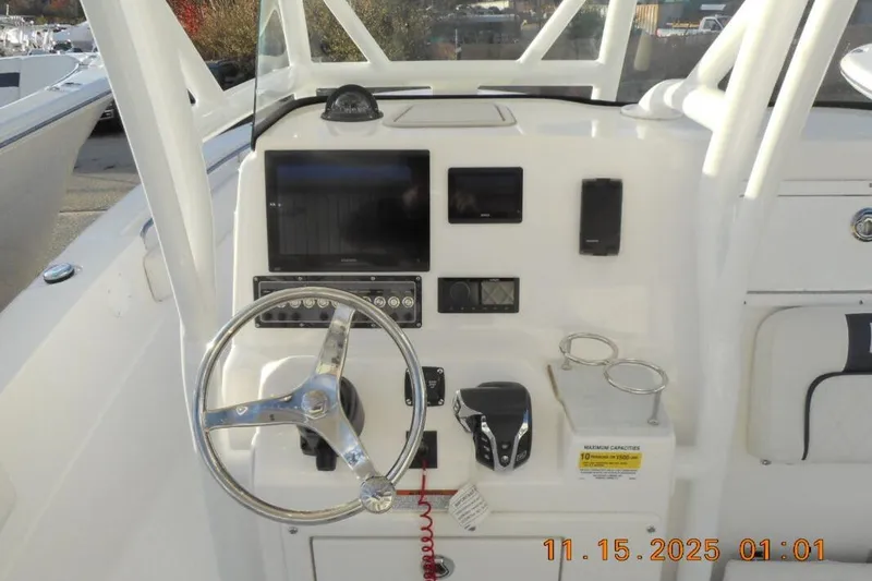 Slide: The Image of Steering console of 2026 Sea Fox 248 Side Console boat with modern controls and display. - 8