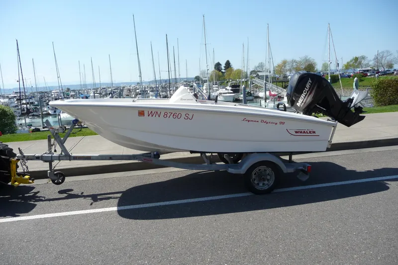 The Image of 2016 Boston Whaler 130 Super Sport boat on trailer near marina. - 1