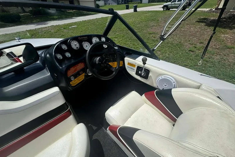 Slide: The Image of Interior of a 1992 Nautique Ski Nautique 200 boat, featuring steering wheel and dashboard controls. - 10