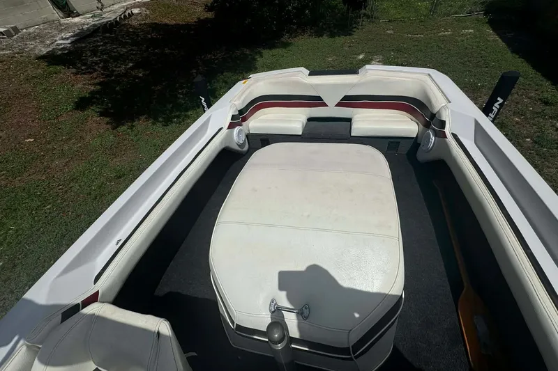 Slide: The Image of 1992 Nautique Ski Nautique 200 Closed Bow interior with white seating and carpeted floor. - 7