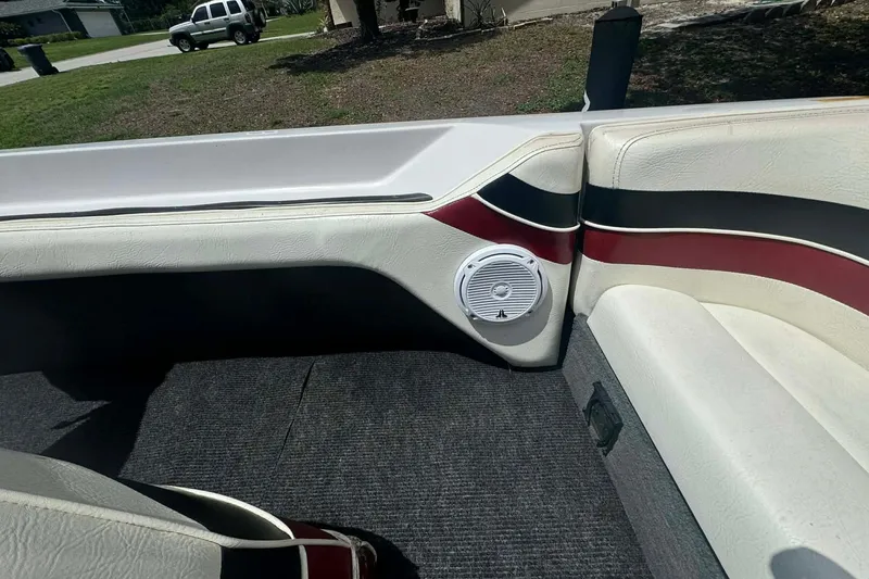 Slide: The Image of Interior of a 1992 Nautique Ski Nautique 200 boat, featuring white and red upholstery. - 8