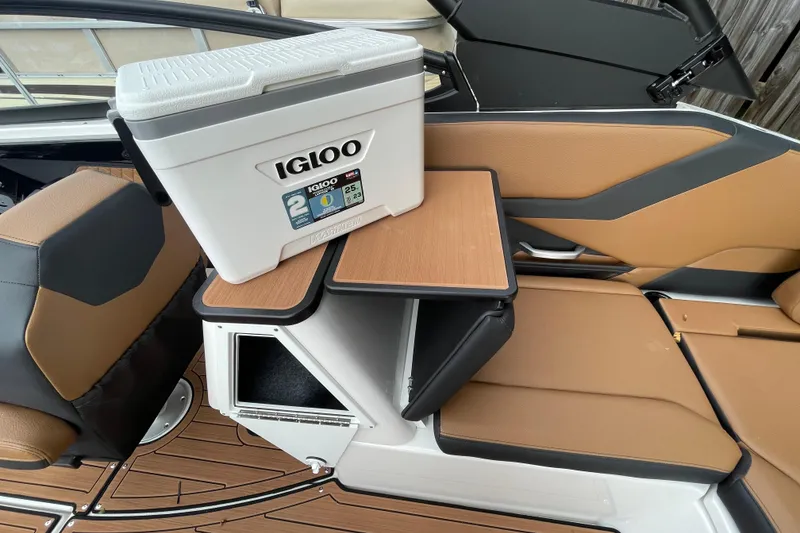 Slide: The Image of 2026 Yamaha Boats 252SD interior with Igloo cooler on foldable table. - 16