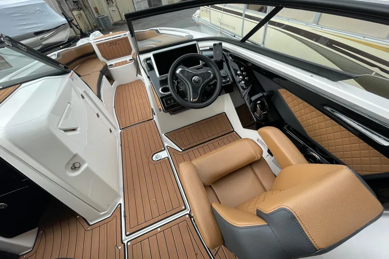 Slide: The Image of 2026 Yamaha Boats 252SD interior with tan leather seats and modern dashboard design. - 4