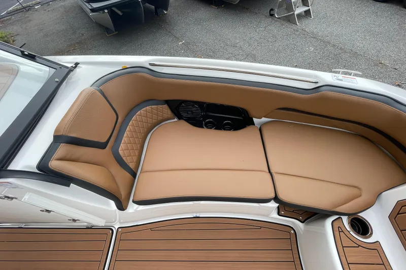 Slide: The Image of 2026 Yamaha Boats 252SD interior with tan seating and wood-style flooring. - 9