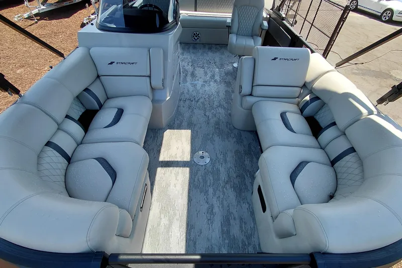 Slide: The Image of Luxurious interior of 2026 Starcraft RX 23 Q DH pontoon boat with plush seating. - 10