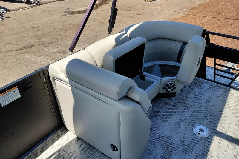 Slide: The Image of 2026 Starcraft RX 23 Q DH boat interior with luxurious seating and integrated speaker system. - 12