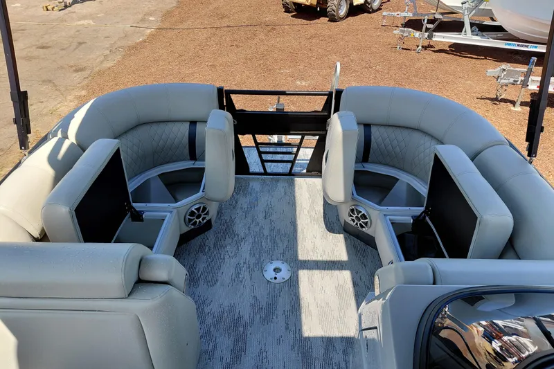 Slide: The Image of Luxurious seating on 2026 Starcraft RX 23 Q DH pontoon boat, featuring modern design and speakers. - 16