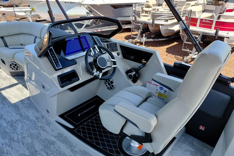 Slide: The Image of Interior view of 2026 Starcraft RX 23 Q DH boat with modern helm and seating. - 19