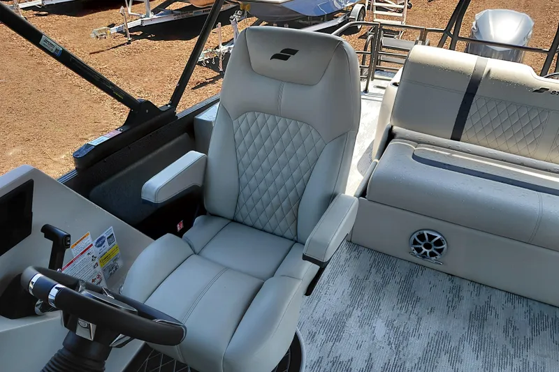 Slide: The Image of Luxurious interior of 2026 Starcraft RX 23 Q DH boat with plush seating and modern design. - 22