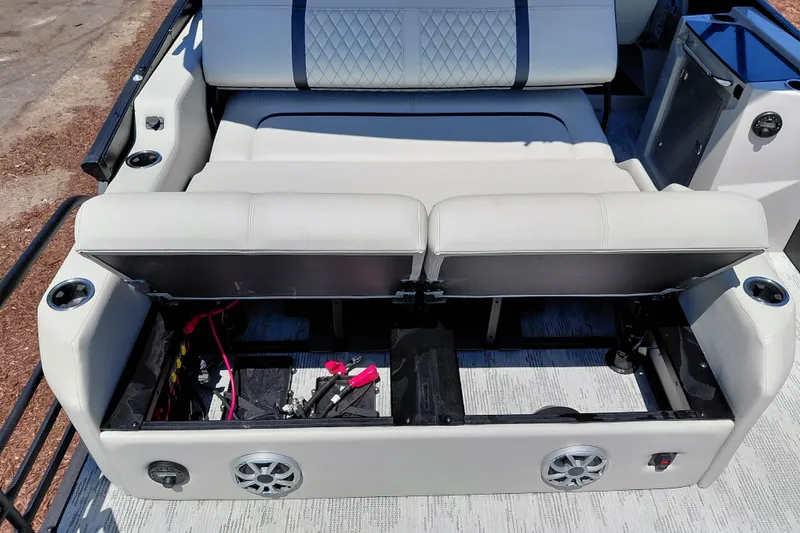 Slide: The Image of 2026 Starcraft RX 23 Q DH boat interior with open storage compartment and seating. - 31