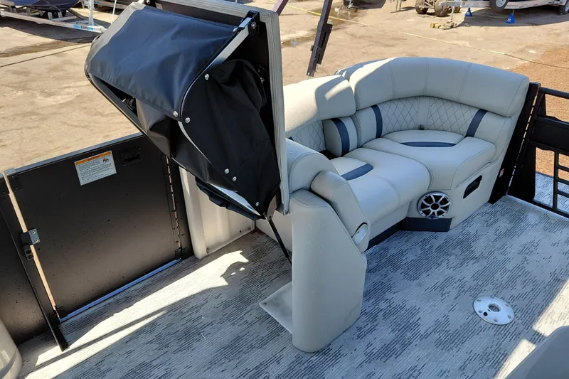 Slide: The Image of Luxurious seating on 2026 Starcraft RX 23 Q DH boat, featuring premium upholstery and integrated speaker. - 38