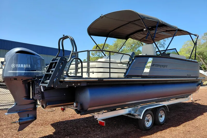 Slide: The Image of 2026 Starcraft RX 23 Q DH pontoon boat with Yamaha engine on trailer. - 4