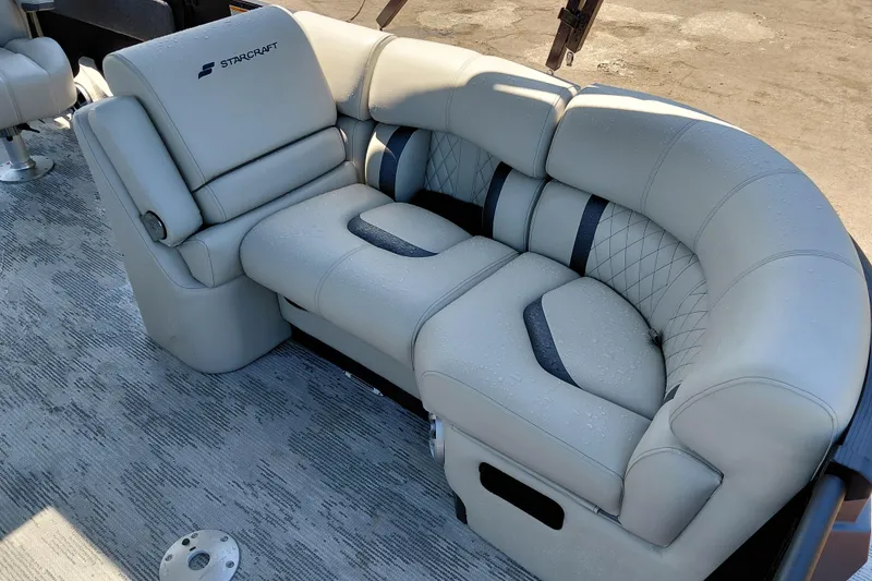 Slide: The Image of Luxurious seating on 2026 Starcraft RX 23 Q DH boat, featuring plush upholstery and modern design. - 8