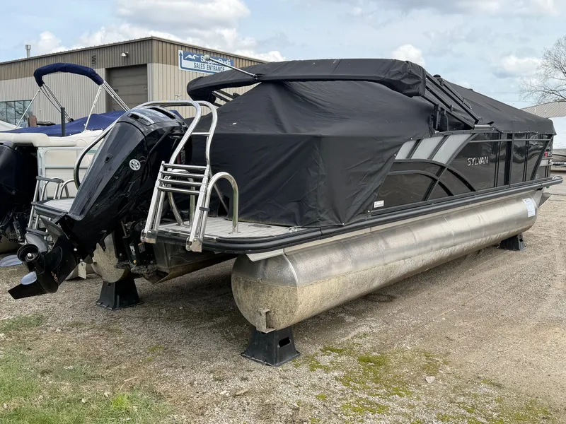 Slide: The Image of 2022 Sylvan L3 RLZ pontoon boat with cover in a parking lot. - 16