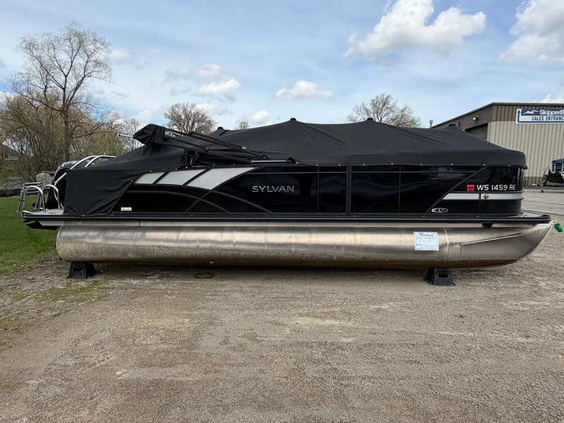 Slide: The Image of 2022 Sylvan L3 RLZ pontoon boat with cover on gravel lot. - 17