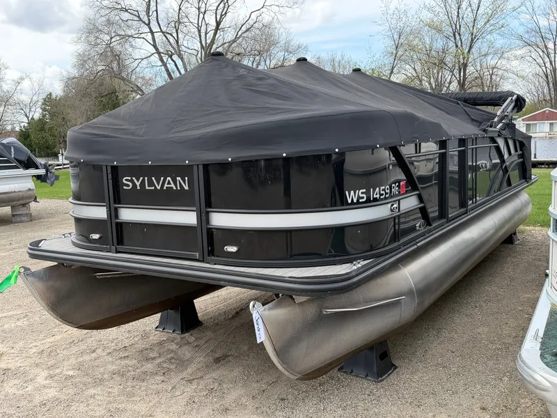 Slide: The Image of 2022 Sylvan L3 RLZ pontoon boat with cover on gravel surface. - 19