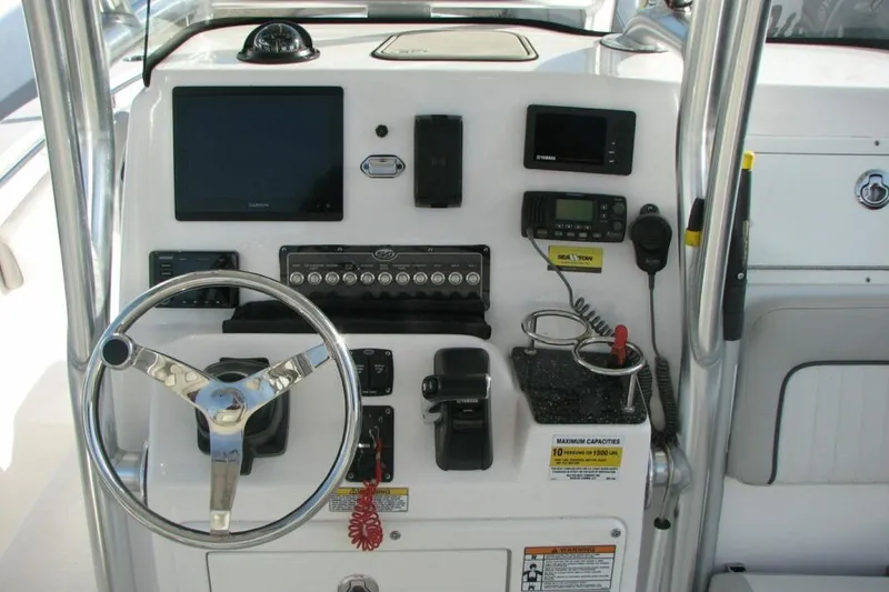 Slide: The Image of Control panel of a 2020 Sea Fox 249 Avenger boat with steering wheel and electronics. - 4