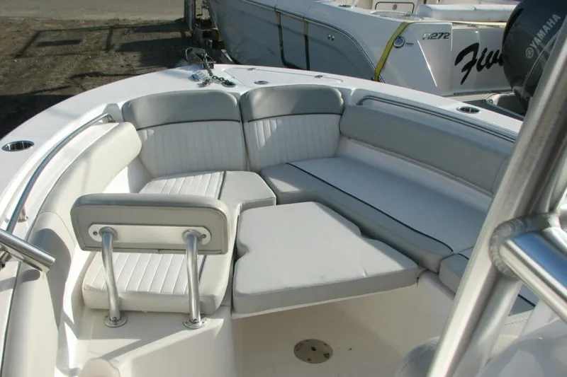 Slide: The Image of 2020 Sea Fox 249 Avenger boat interior with cushioned seating area. - 8