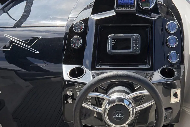 Slide: The Image of Dashboard of 2025 NX Boats NX270 featuring controls and instruments. - 3