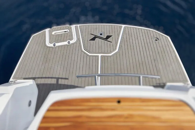 Slide: The Image of Rear view of 2025 NX Boats NX270 on the water. - 6