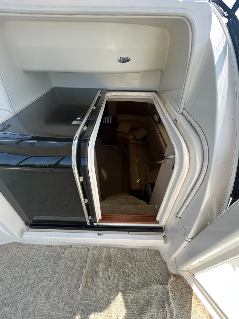 Slide: The Image of The image shows the entrance to a cabin with a glass door and a beige sofa inside. - 17