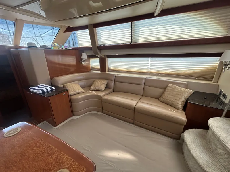 Slide: The Image of Interior of a 2007 Meridian 368 Motoryacht with beige leather sofa and wooden table. - 20
