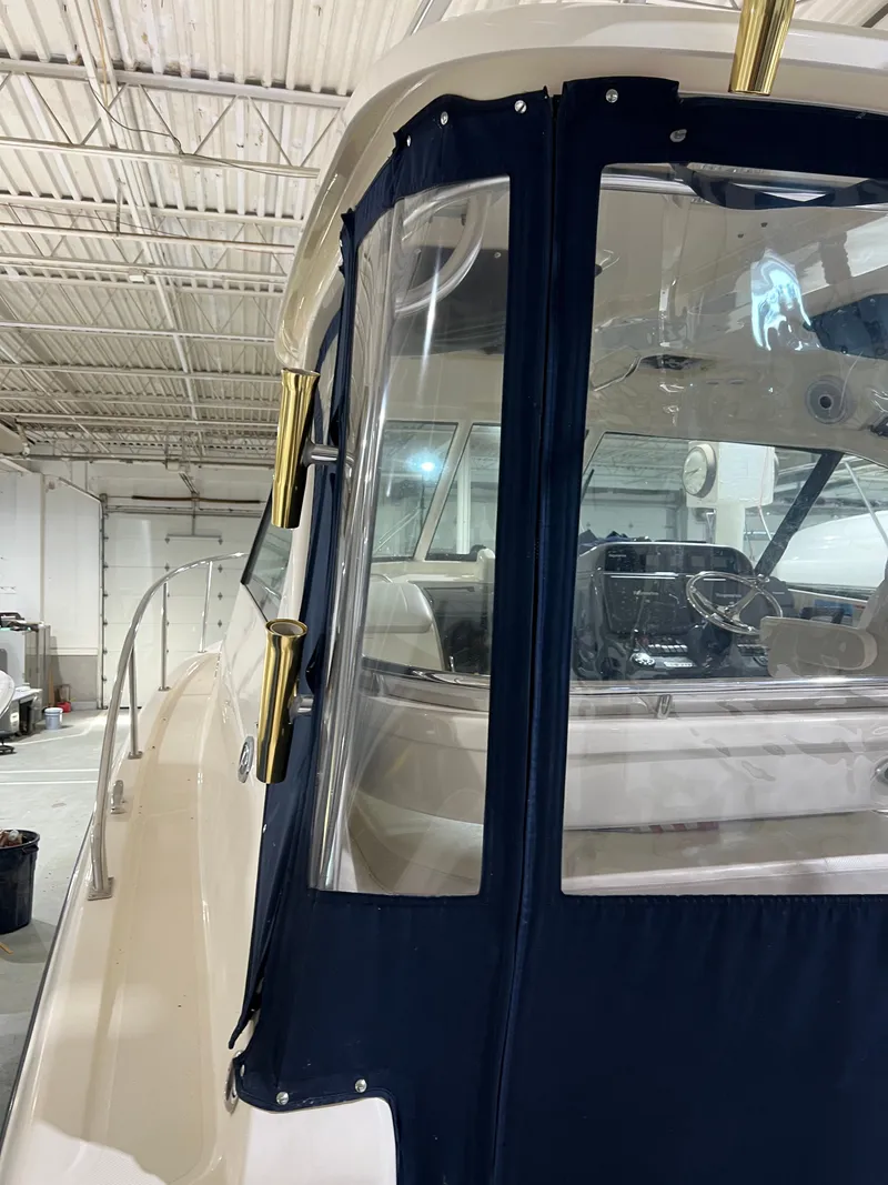 Slide: The Image of 2008 Pursuit OS 315 Offshore boat in a storage facility. - 12