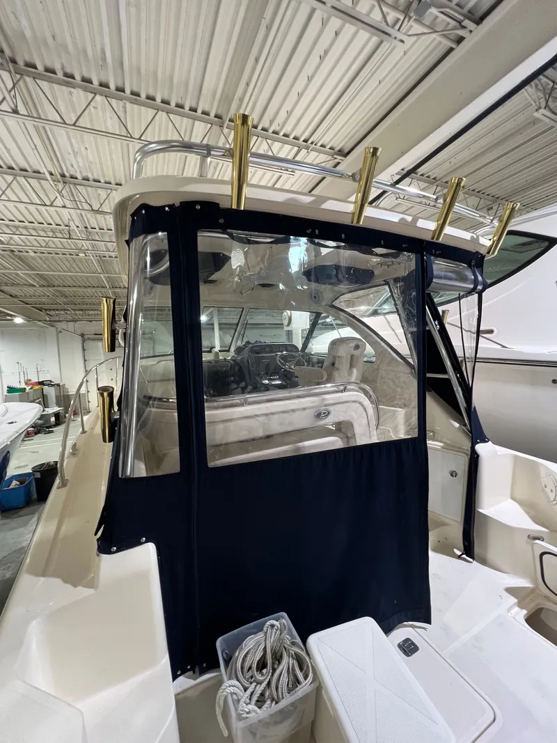 Slide: The Image of 2008 Pursuit OS 315 Offshore boat in indoor storage. - 13