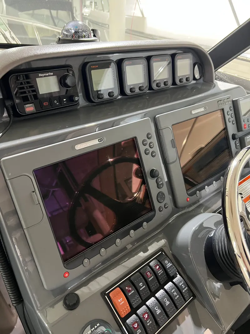 Slide: The Image of Dashboard of a 2008 Pursuit OS 315 Offshore boat. - 19