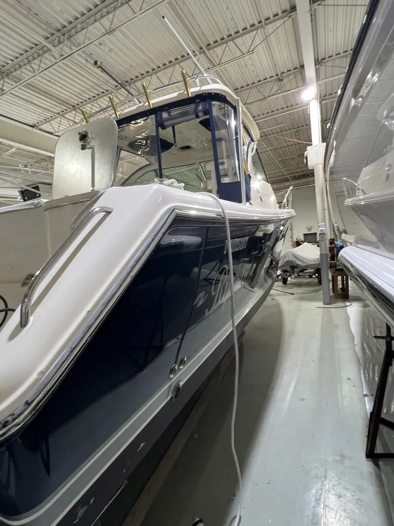 Slide: The Image of 2008 Pursuit OS 315 Offshore boat in storage facility. - 2