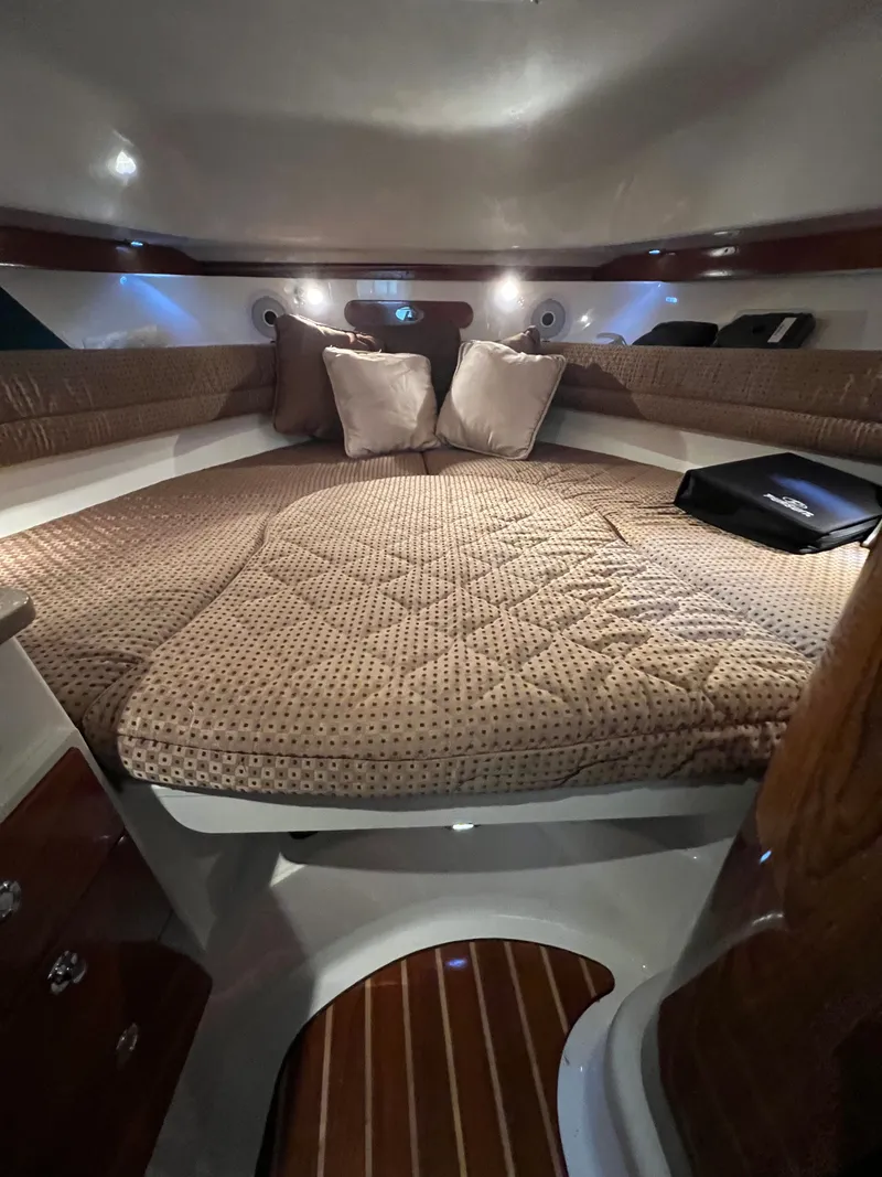 Slide: The Image of Interior of a 2008 Pursuit OS 315 Offshore with cozy bed. - 28