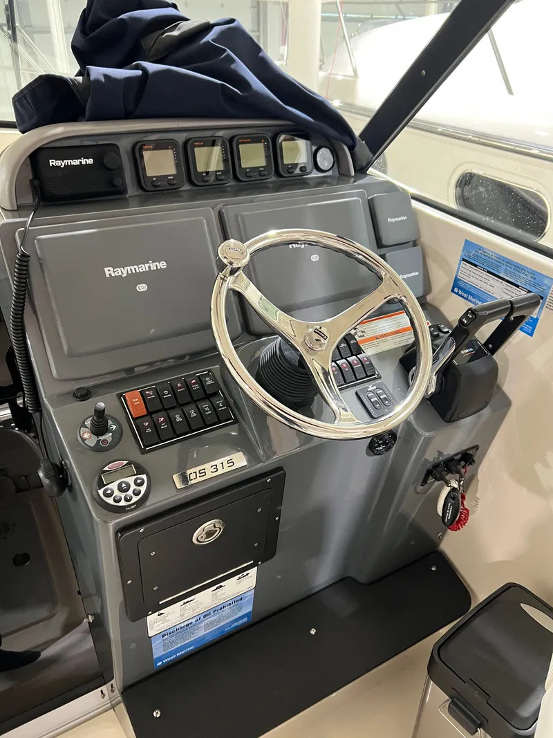 Slide: The Image of Helm console of a 2008 Pursuit OS 315 Offshore boat. - 4