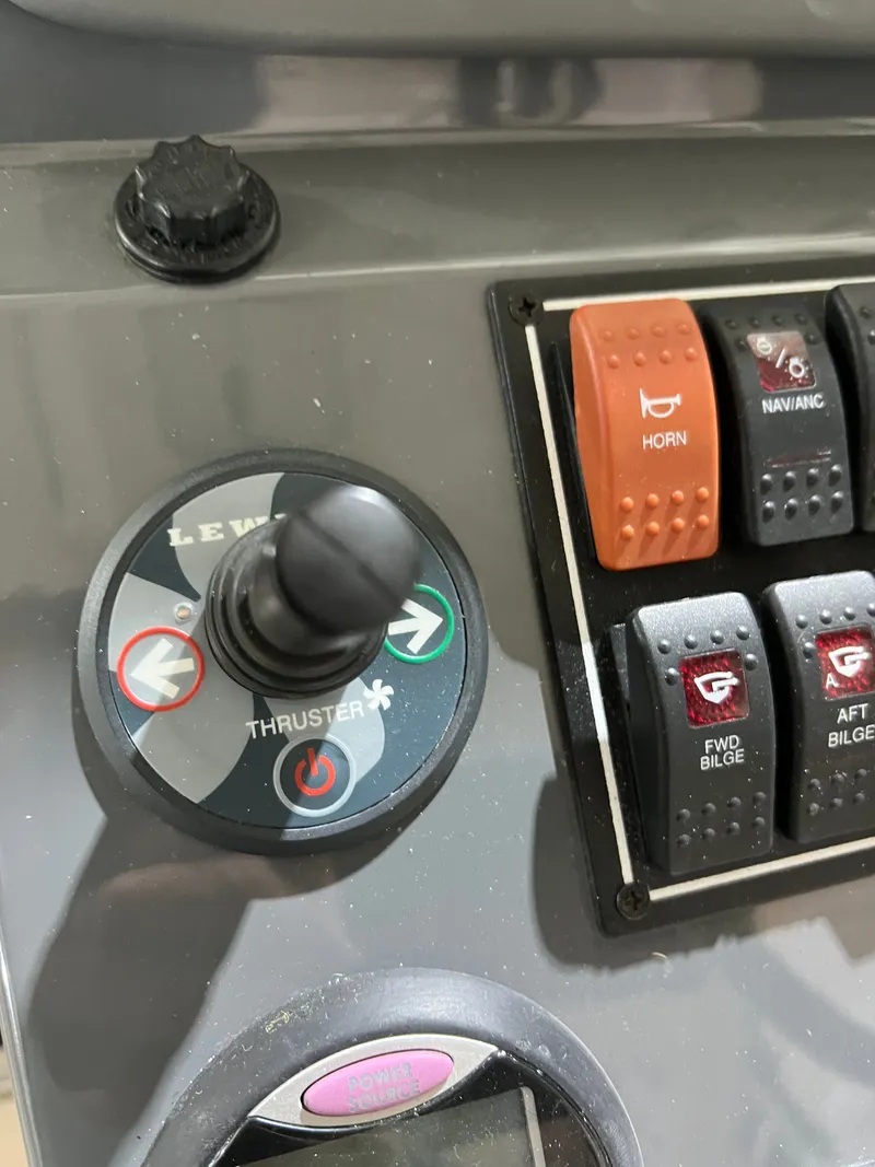 Slide: The Image of Control panel of a 2008 Pursuit OS 315 Offshore boat. - 5