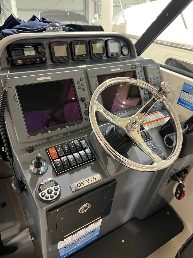 Slide: The Image of Helm console of a 2008 Pursuit OS 315 Offshore boat. - 6