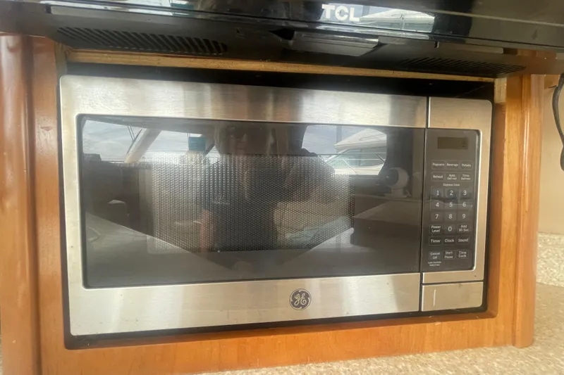 Slide: The Image of Built-in GE microwave in a 2004 Meridian 341 Sedan yacht kitchen. - 16