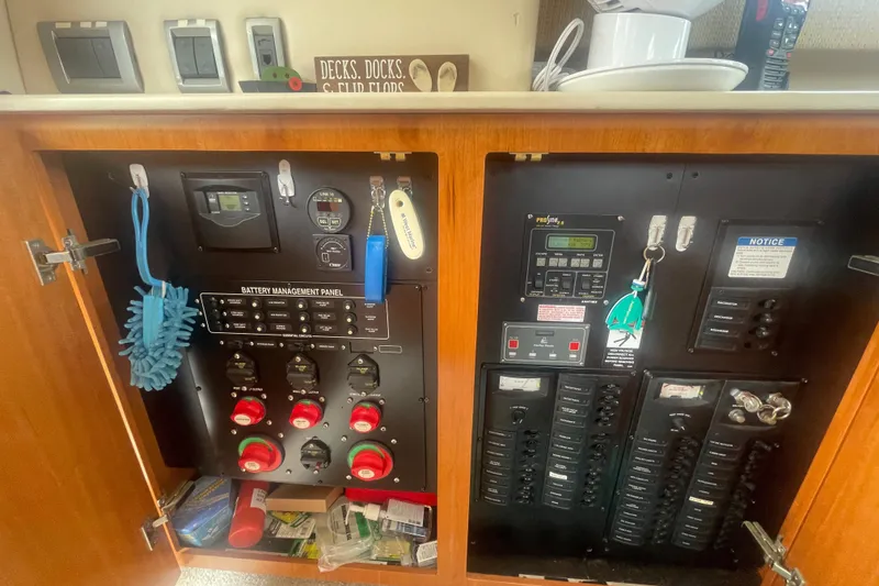 Slide: The Image of Electrical control panel inside a 2004 Meridian 341 Sedan boat cabinet. - 18
