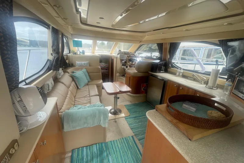 Slide: The Image of Luxurious interior of a 2004 Meridian 341 Sedan yacht with cozy seating and modern amenities. - 7