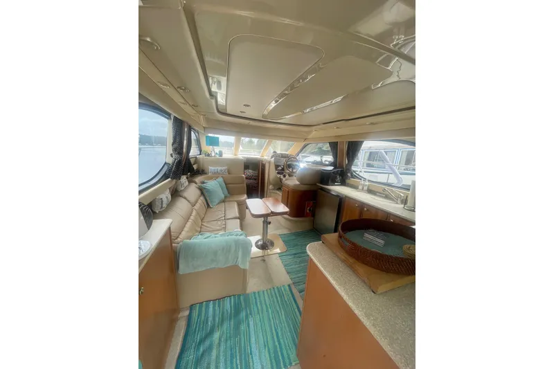 Slide: The Image of Luxurious interior of a 2004 Meridian 341 Sedan yacht with elegant seating and decor. - 8