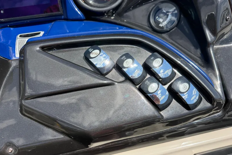 Slide: The Image of Control panel of a 2018 JC 25 Neptoon DSL boat with labeled switches. - 17