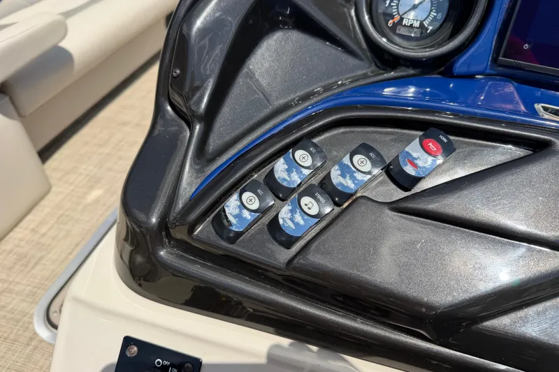 Slide: The Image of Control panel of a 2018 JC 25 Neptoon DSL boat with labeled switches. - 18