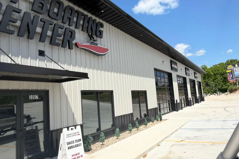 Slide: The Image of Boating center exterior with sales sign, featuring JC 25 Neptoon DSL, 2018 model. - 19