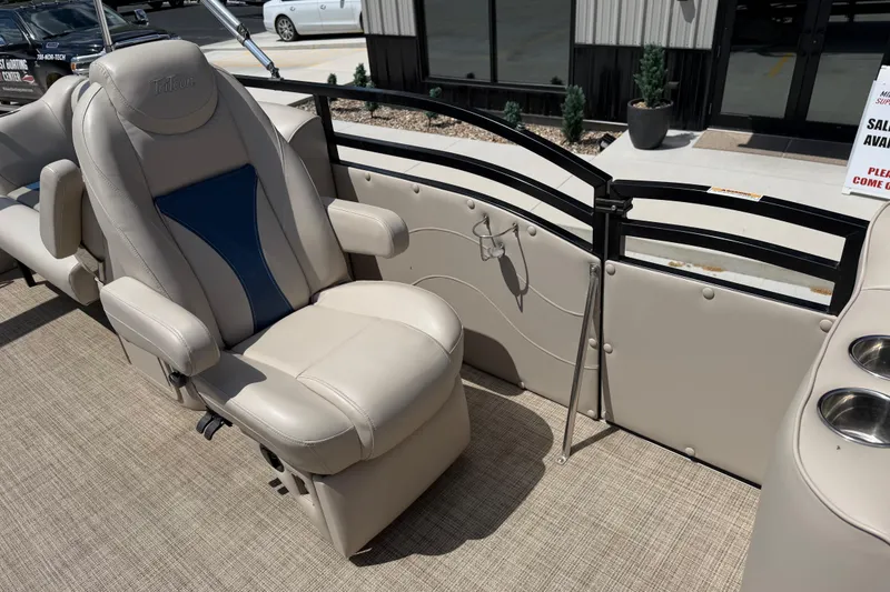 Slide: The Image of Luxurious seating on 2018 JC 25 Neptoon DSL pontoon boat, featuring beige upholstery and cup holders. - 24