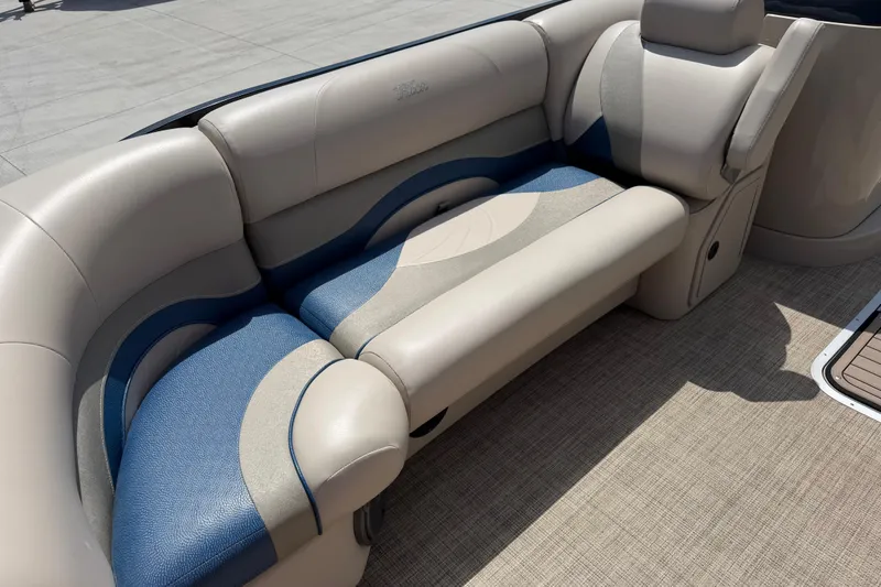 Slide: The Image of 2018 JC 25 Neptoon DSL boat interior with beige and blue seating. - 26