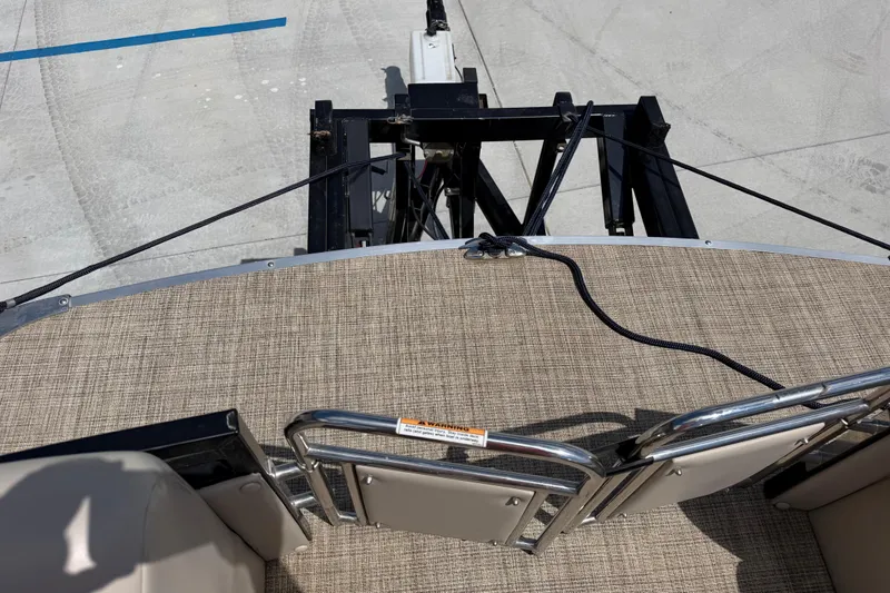 Slide: The Image of 2018 JC 25 Neptoon DSL boat deck with railing and rope, viewed from above. - 27