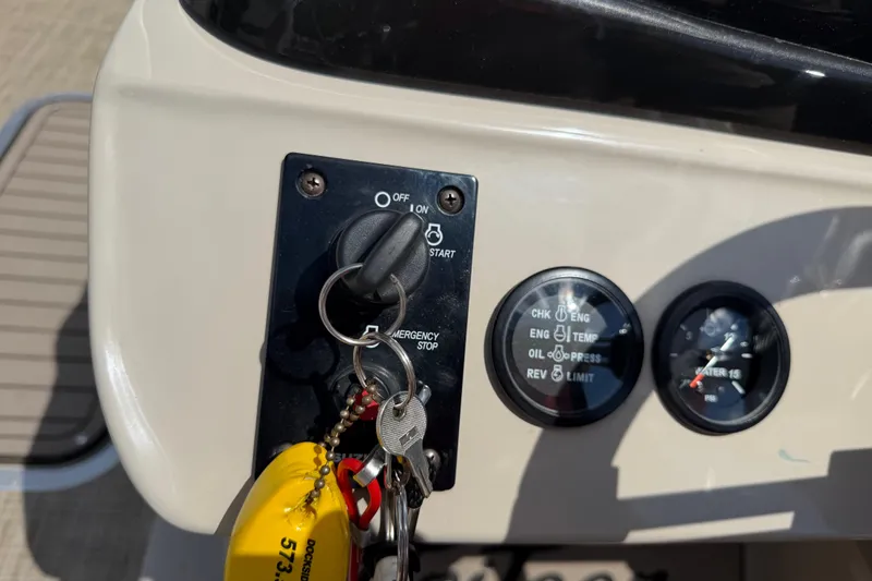 Slide: The Image of Control panel of a 2018 JC 25 Neptoon DSL boat with ignition keys. - 29